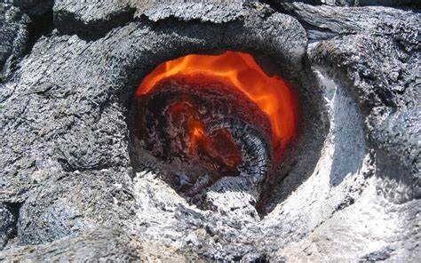 USGS OIP photo of a hole in still cooling lava leaves the fossil impression of a tree trunk