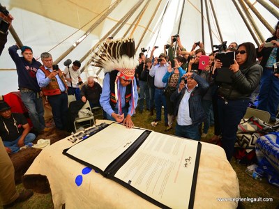 Members of the eight reservations take turns signing the Buffalo Treaty Members of the eight reservations take turns signing the Buffalo Treaty