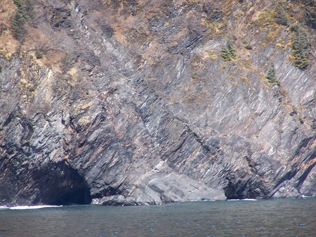 KEFJ accretionary wedge sandstone and shale@10x rocky cliff and shoreline