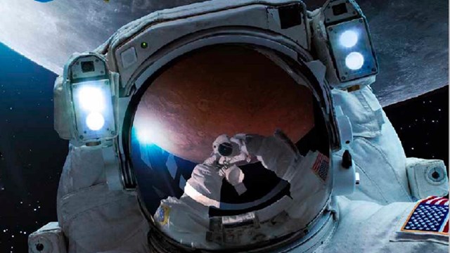 image of astronaut in front of the moon
